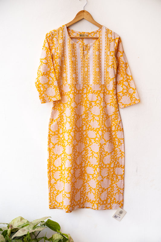 Block printed kurta with vertical stripes yoke + hand embroidery.