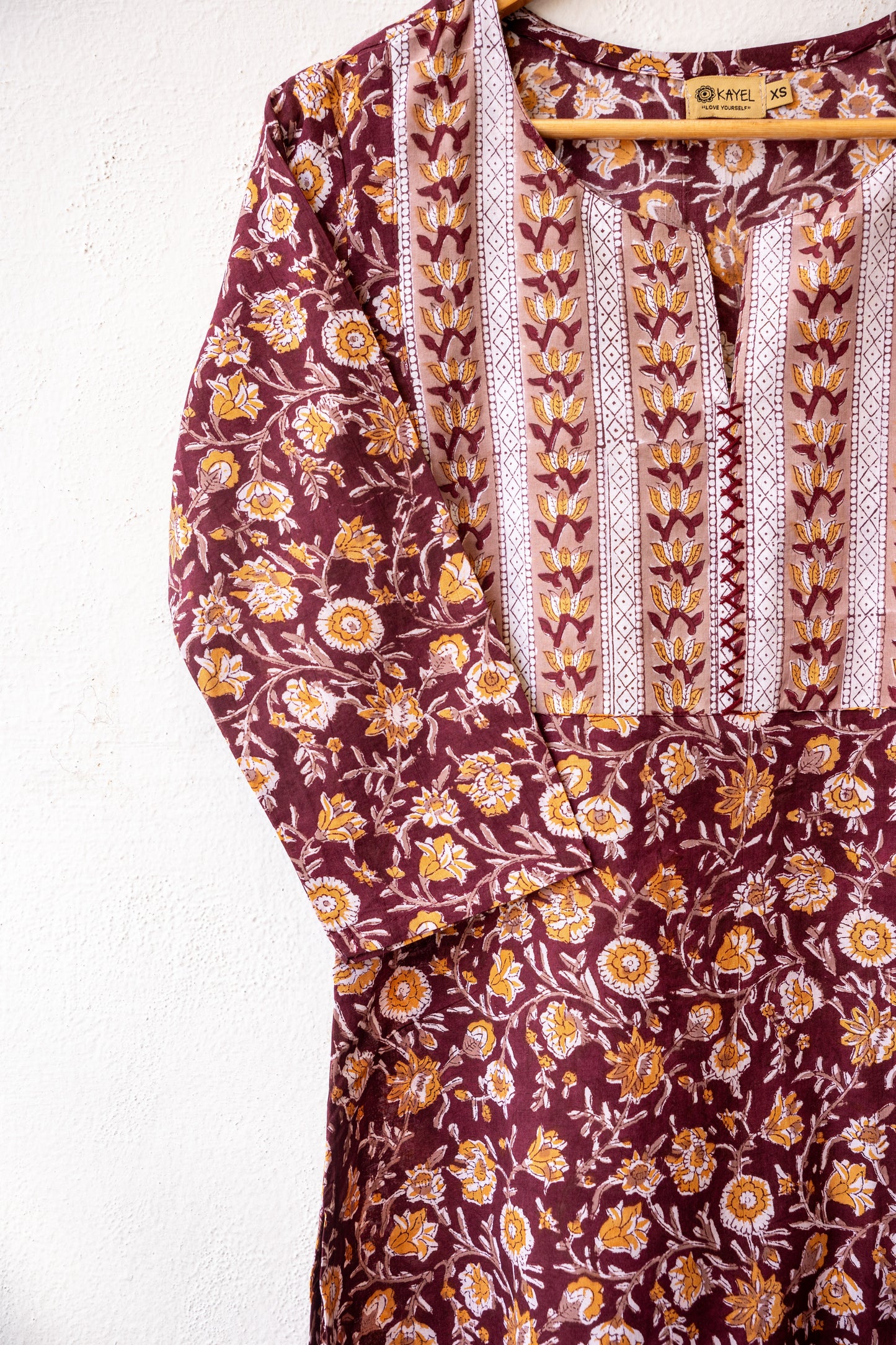Block printed kurta with vertical stripes yoke + hand embroidery.