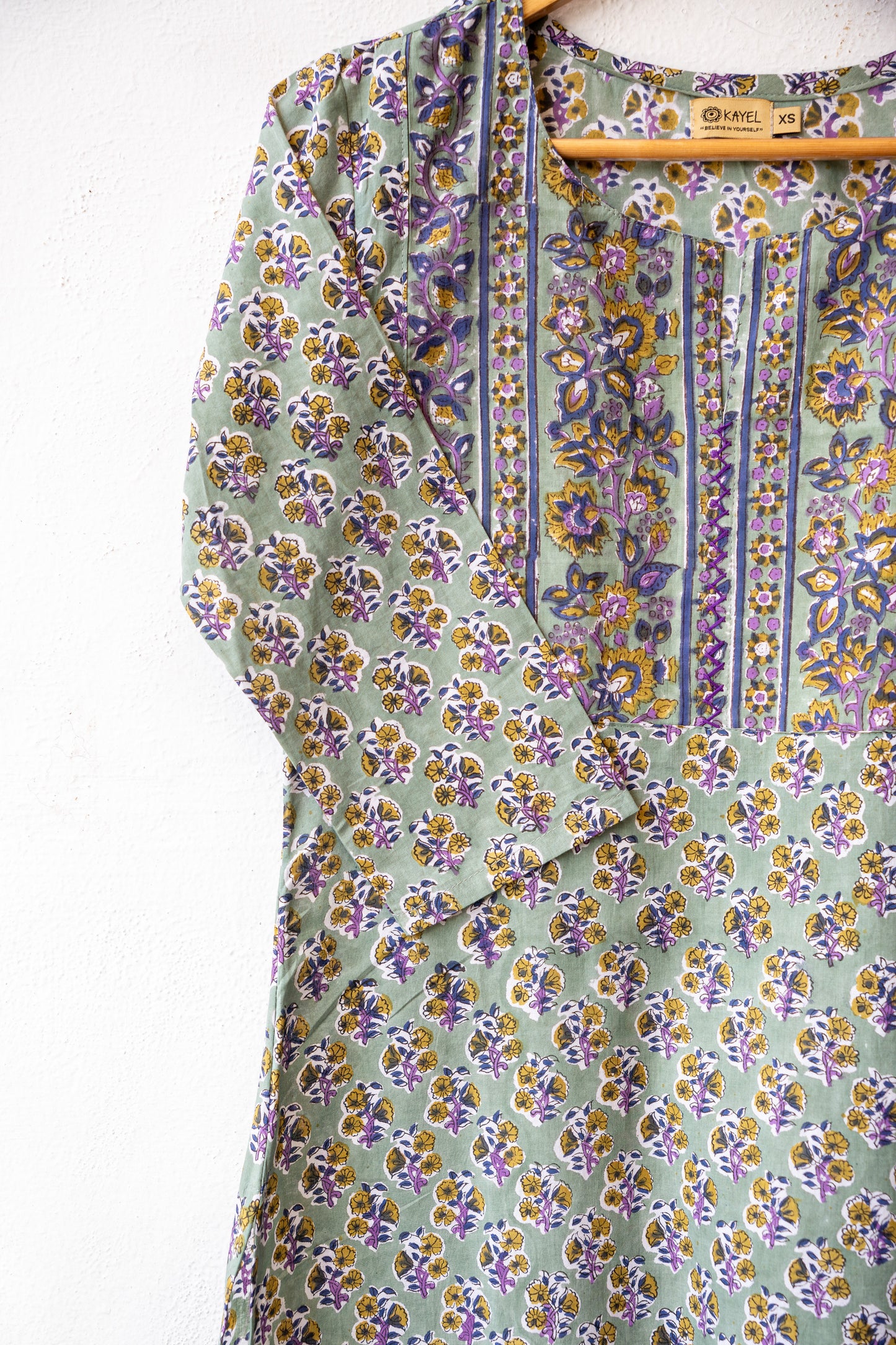 Block printed kurta with vertical stripes yoke + hand embroidery.