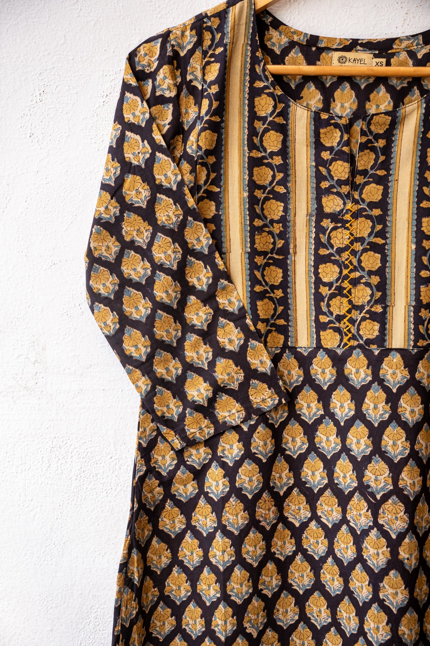 Block printed kurta with vertical stripes yoke + hand embroidery.